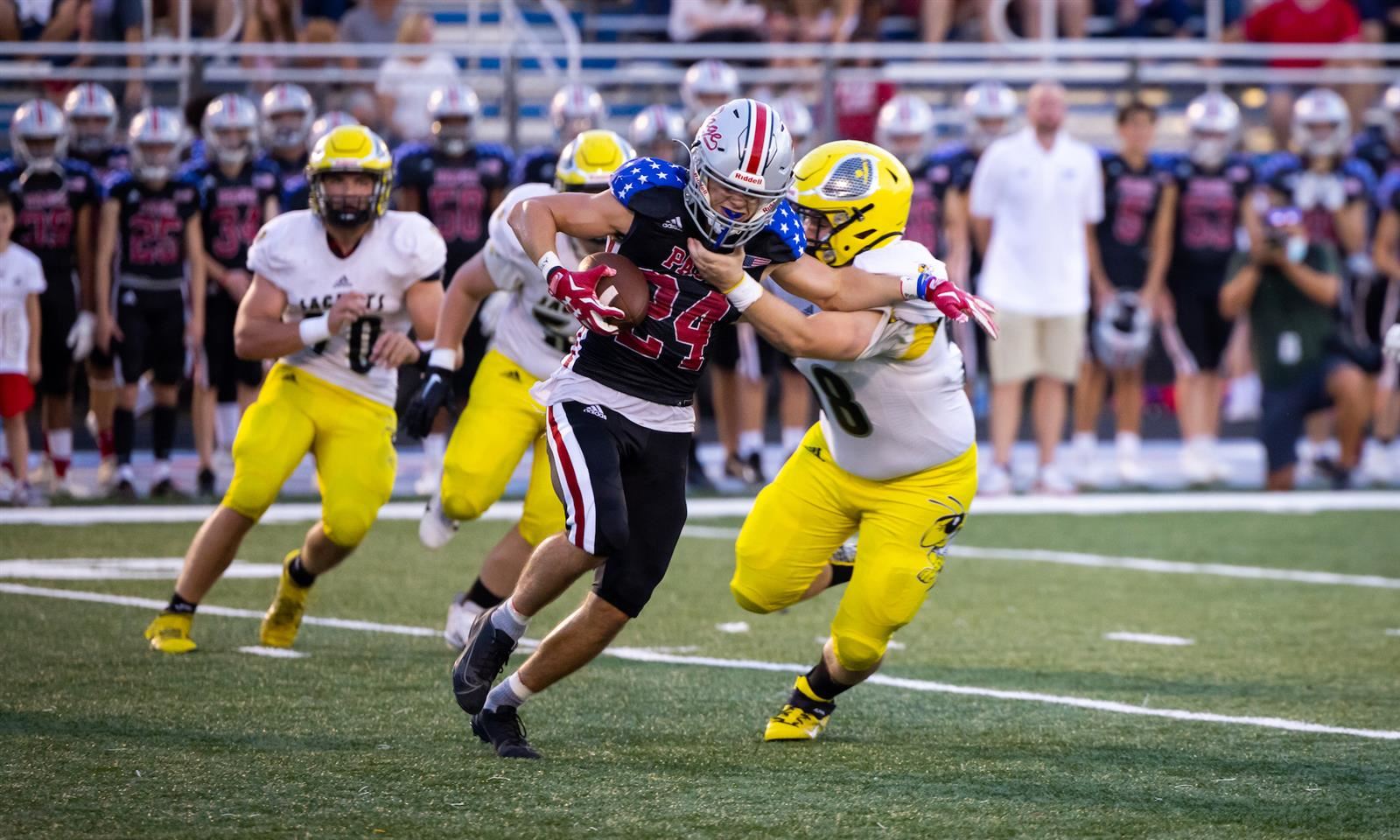 Fairview High football players tackle a Page High player